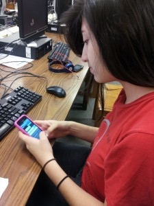 Sophomore Sheila Aguilar texting on her phone