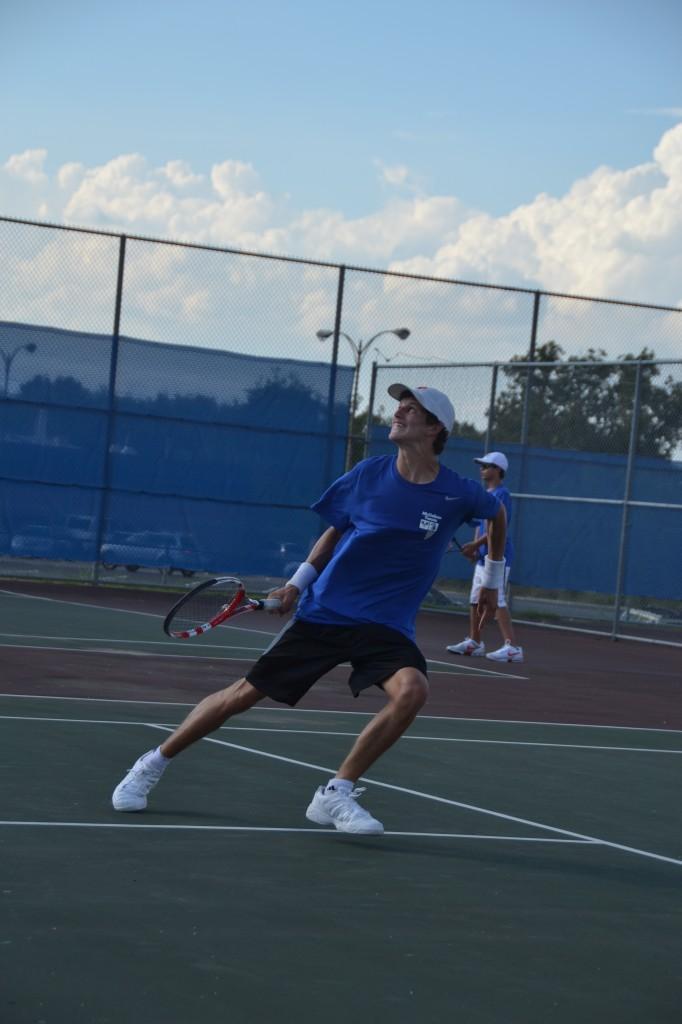Senior Alonso Fernandez runs back to return a ball going over his head. He won his singles match against his LBJ opponent in the dual match at McCallum Sept. 16.