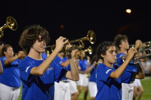 Sophomores Amon Stewart (left) and Mollie Adolph march in the Taco Shack halftime show.