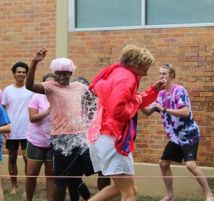 Senior David Ruwwe takes a water balloon to the back during the PALS annual Pink Week fundraiser "Peg-a-PAL." The PALS raised over $1,200 for Breast Cancer research. Photo by Rylie Jones.