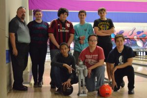 The team strikes a pose between practice games at their home alley, the Dart Bowl on Grover Avenue across from the practice fields. Photo by Sydney Amell.