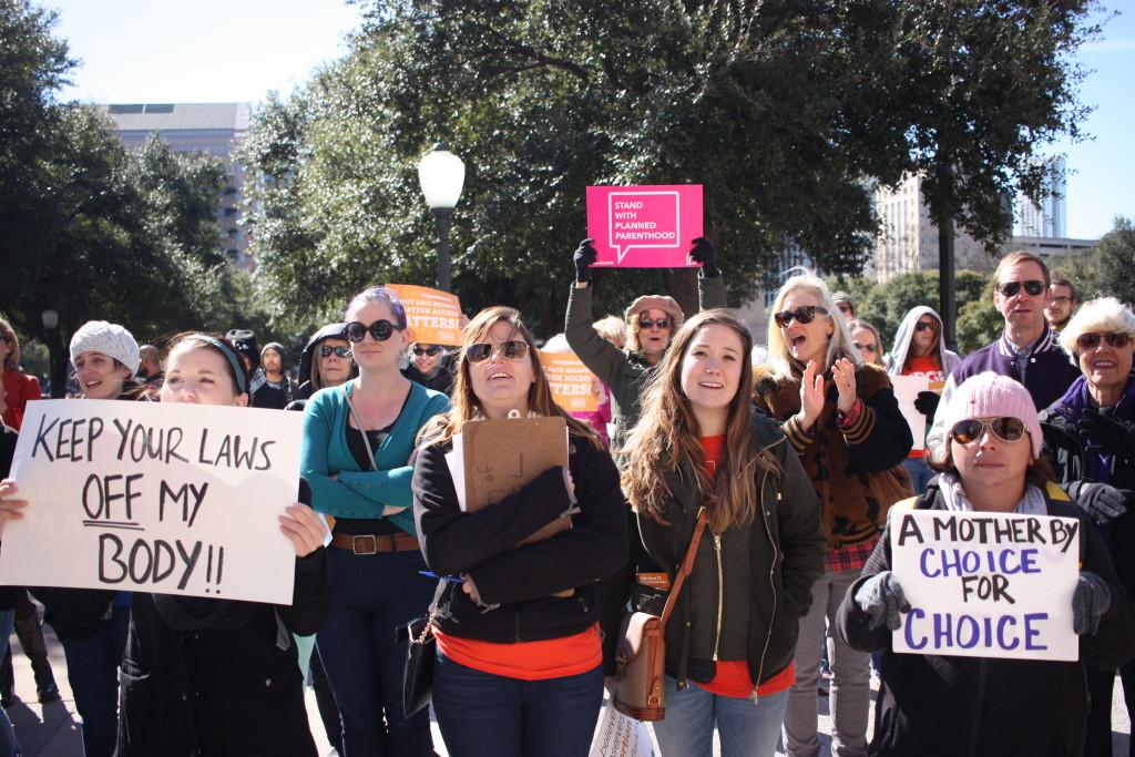 Diana Silva (bottom right) attended the pro-choice rally commemorating the 43rd anniversary of the Roe v. Wade Supreme Court decision at Texas on Jan. 22. "Sex ed should be provided for everyone," Silva said. "It's not just about posting on Facebook or social media, it's about doing something about it." Photo by Ashley Chamberlain.