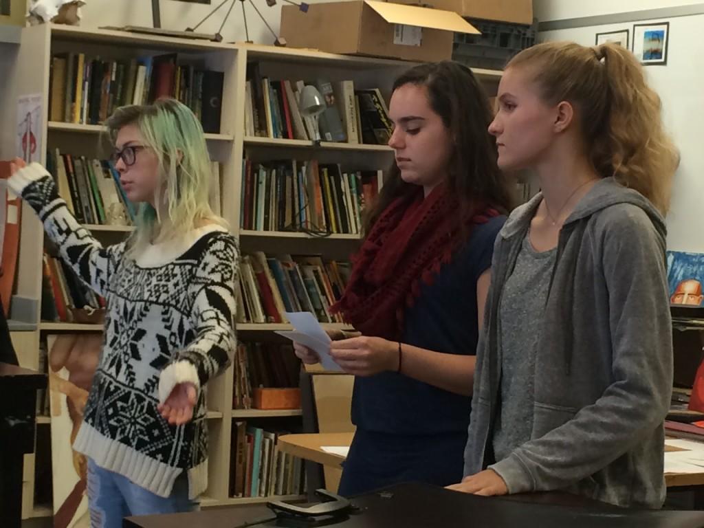 Seniors Clarissa Thompson, Sarafina Fabris-Green and Mia Battle speak during a National Art Honor Society meeting. “It’s meant to promote service hours that are related to art activities,” Fabris-Green said. Photo by Ruby Dietz