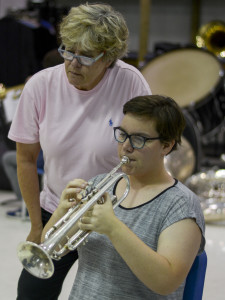 Nelson instructs senior Brooke Heffington on the trumpet on the band room on Sept. 23. Photo by Madison Olsen. 
