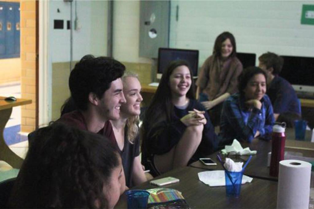 UNITY IS YUMMY: Sacco Fernandez, Annie Lott, Alex Escobar and Ty Bryant share donuts and orange juice at the Spectrum and McCallum Christian Community meeting before school this morning in Mr. Bjerke's room. "We came to the meeting today because we want to love everyone," Lott said. "The McCallum Christian community wants everyone to feel like they have a safe place at this school." Photo by Madison Olsen.