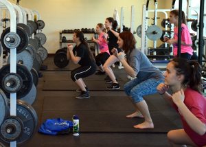 The volleyball team underwent a hour-long dose of crunching, squatting and kick-boxing during fourth period on Jan. 9 in a Zumba routine choreographed by the team. The team suffered all the planning and pain in order to stay in shape and to practice endurance. Coach Northcutt said at the beginning of class: "This will probably last us for the rest of the week." Photo by Brooke Miller. 