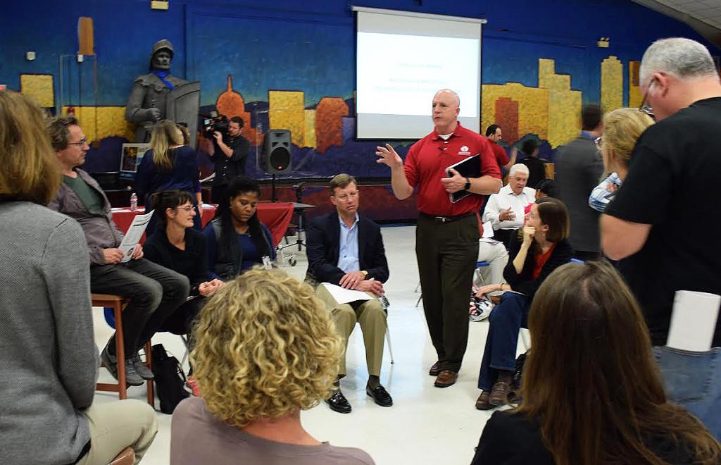 An AISD official moderates a Facilities Master Plan discussion between McCallum teachers and parents. Photo by Sophie Ryland.