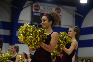 Dos Santos flashes a smile at the crowd during the second annual spring sports pep rally in the gym on Feb. 3. Photo by Dave Winter.