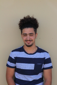 Abdul Hassan stands outside of his World History class. He enjoys learning about ancient civilizations in the Middle East, which he finds fascinating. Photo by Emma Baumgardner.